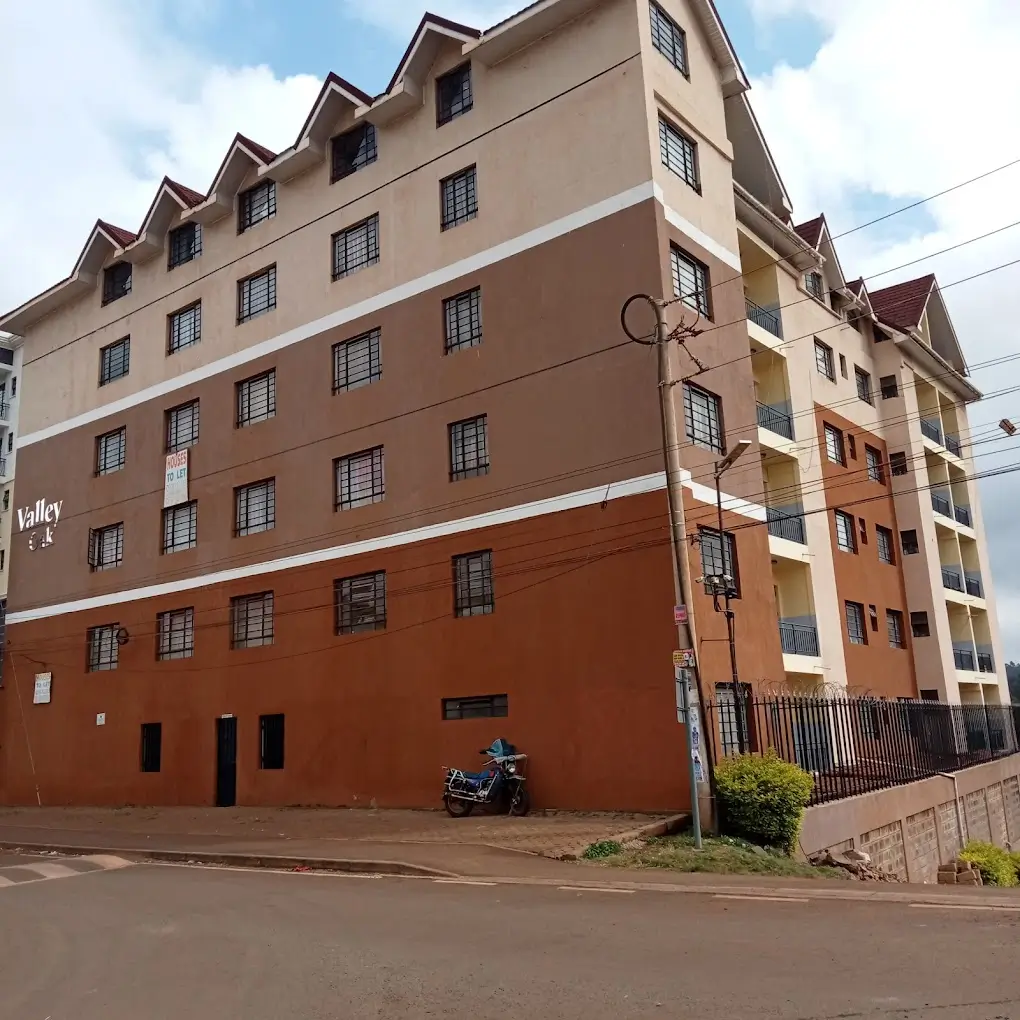 Multi-story residential building facade with mixed color scheme
