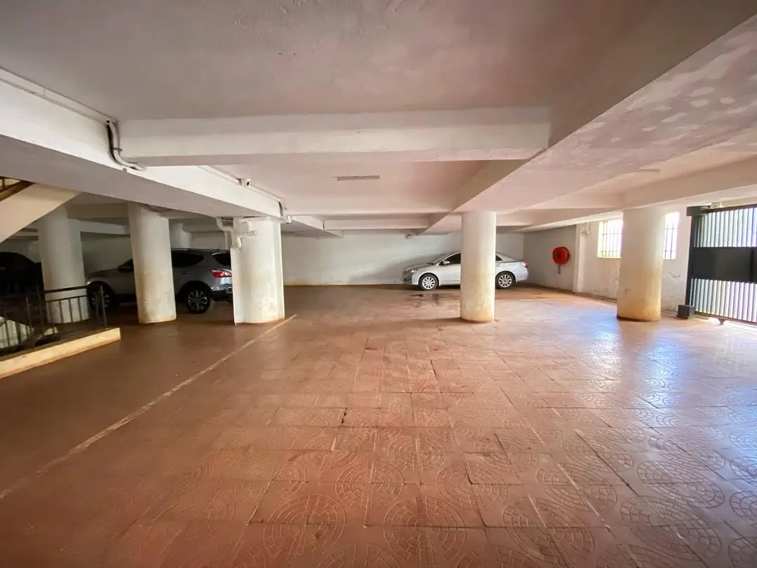 Spacious underground parking garage with multiple vehicle bays
