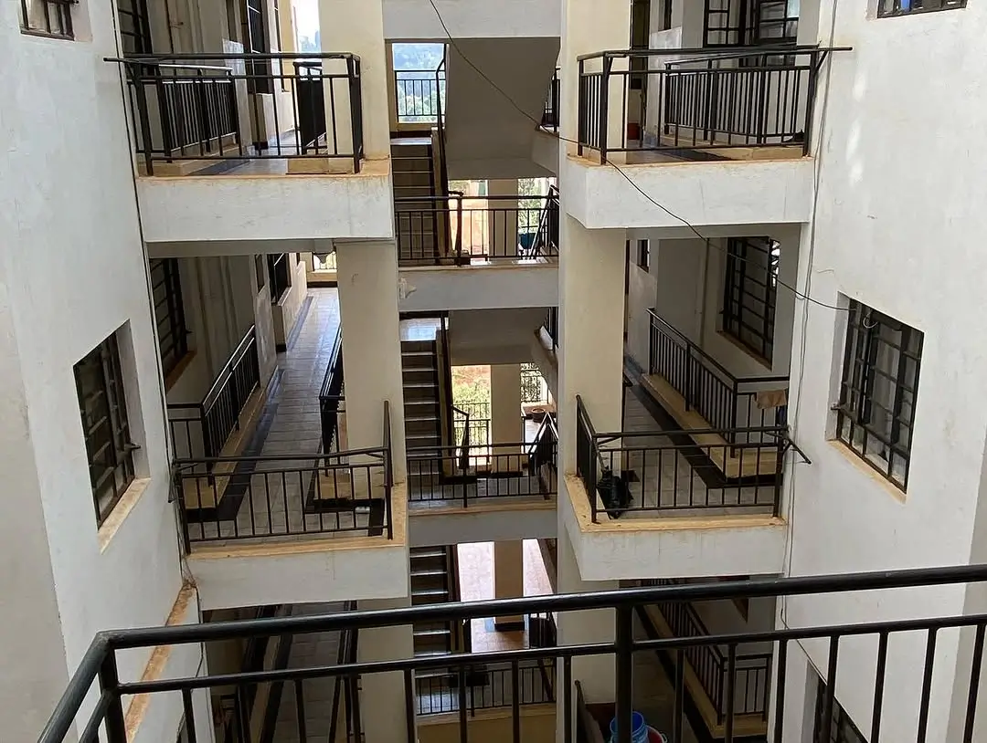 Multi-level atrium with black railings and natural light