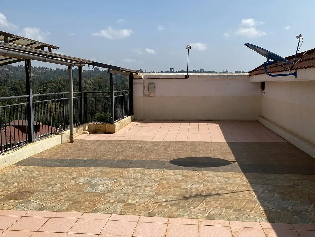 Spacious rooftop terrace with pergola and city views