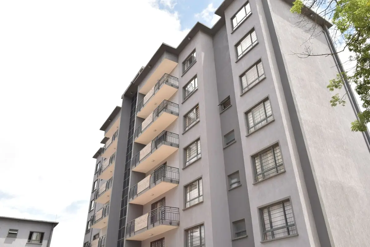 Modern multi-story residential building facade with balconies