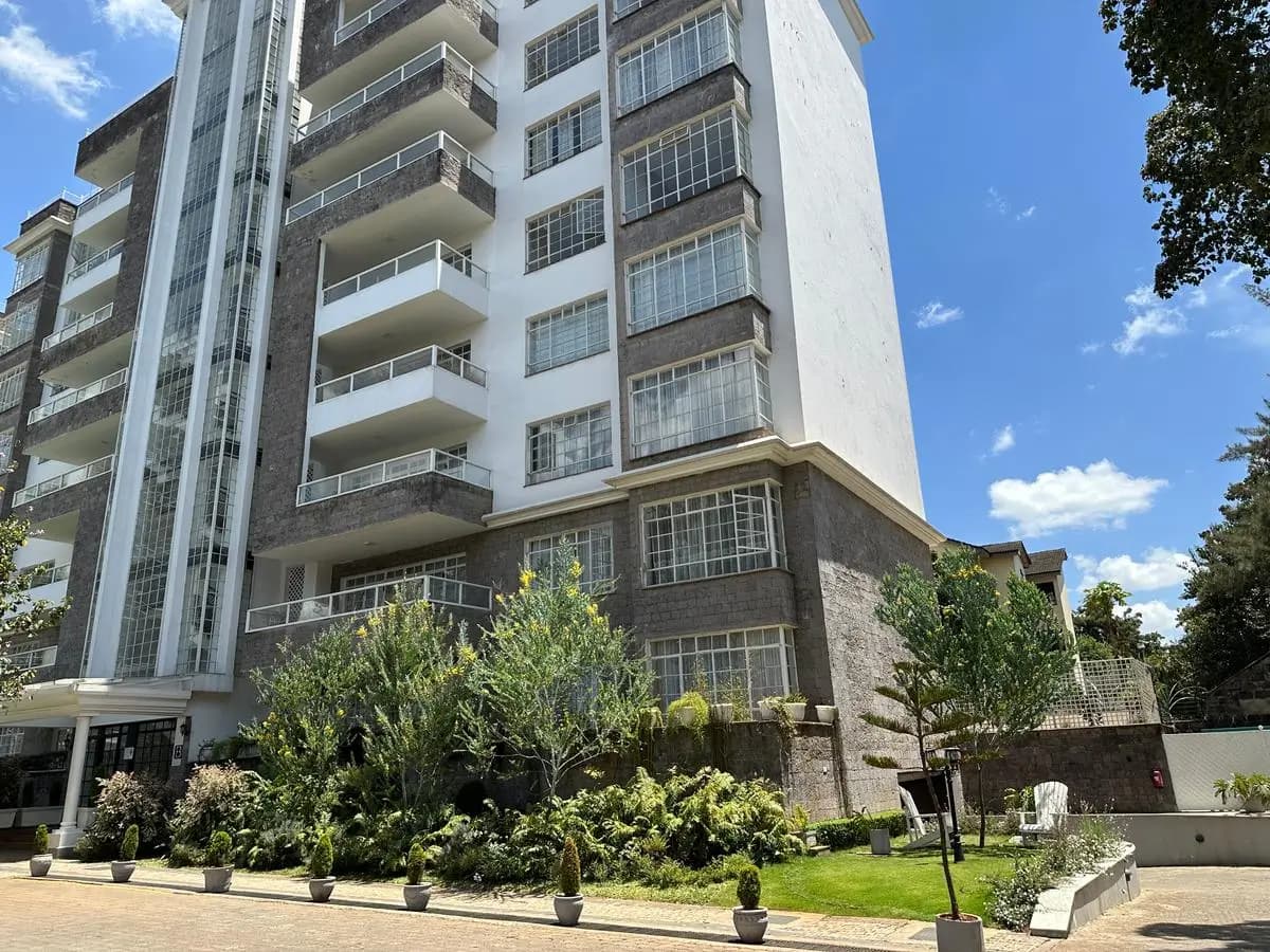 Modern multi-story apartment building with manicured landscaping