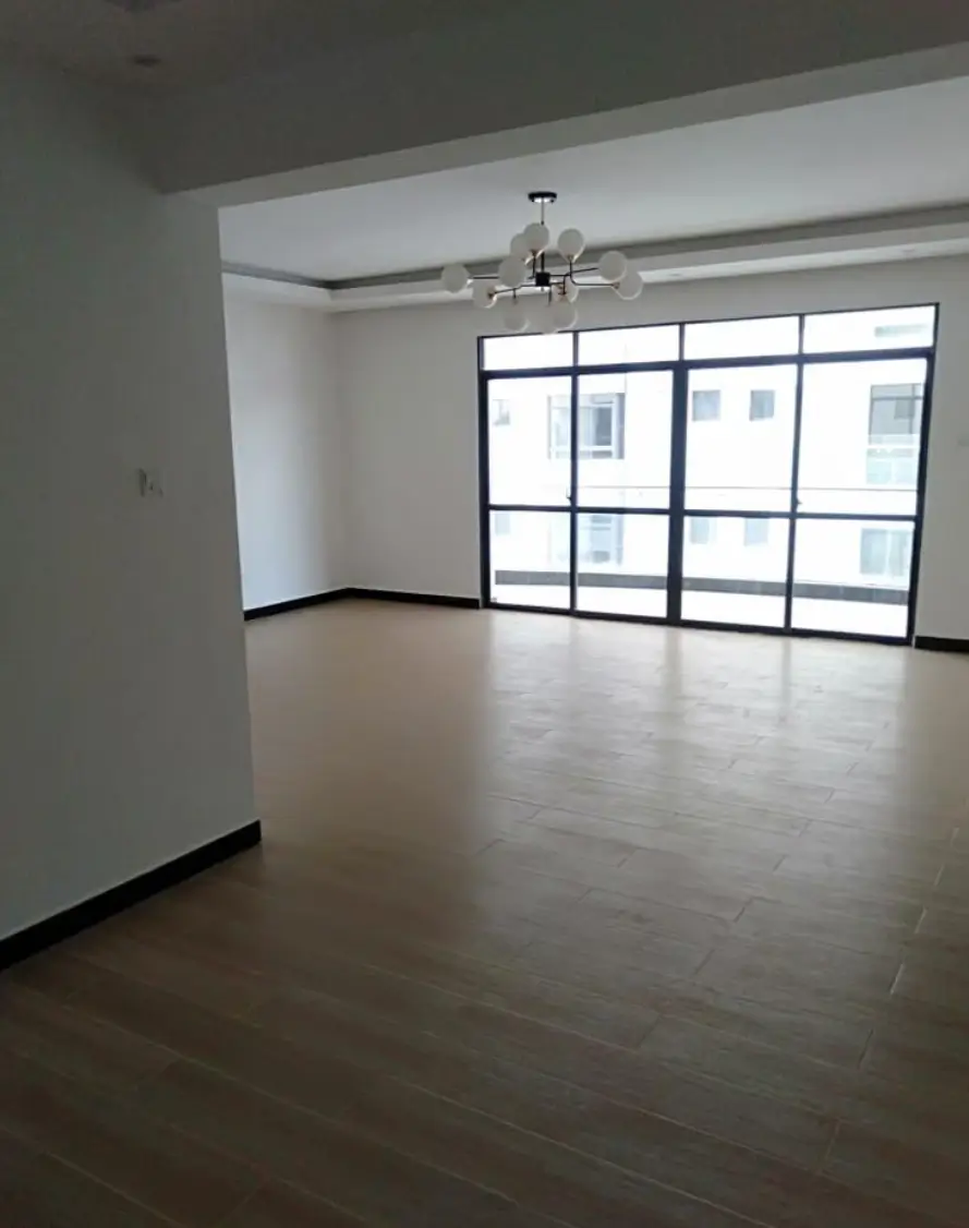 Spacious open-plan living area with floor-to-ceiling windows