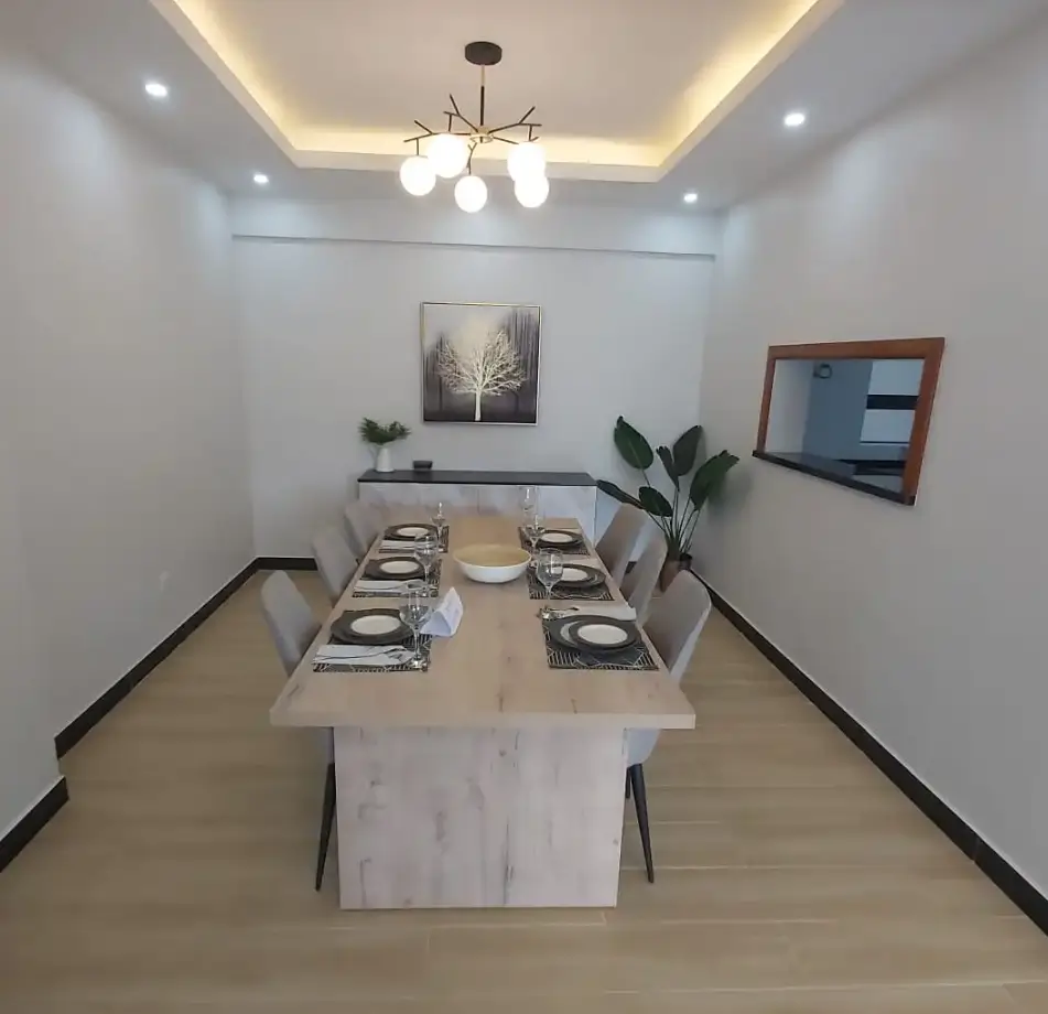 Modern dining room with marble table and contemporary ceiling lighting
