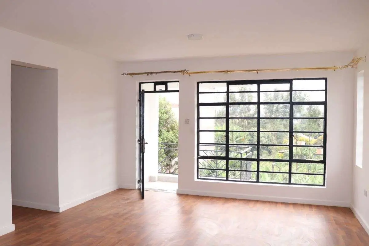 Bright living room with wooden floors and garden views