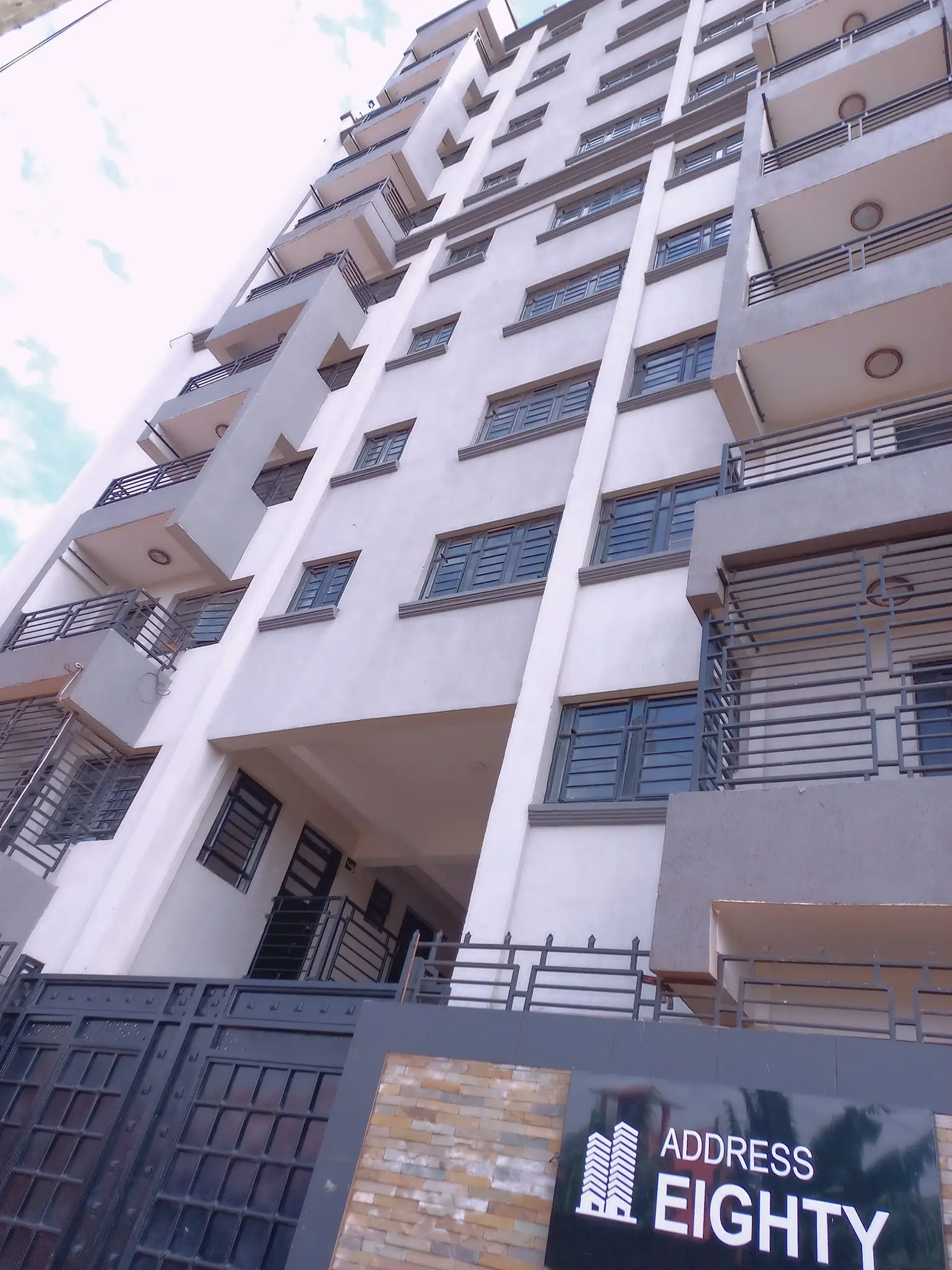 Modern multi-story residential building facade with balconies