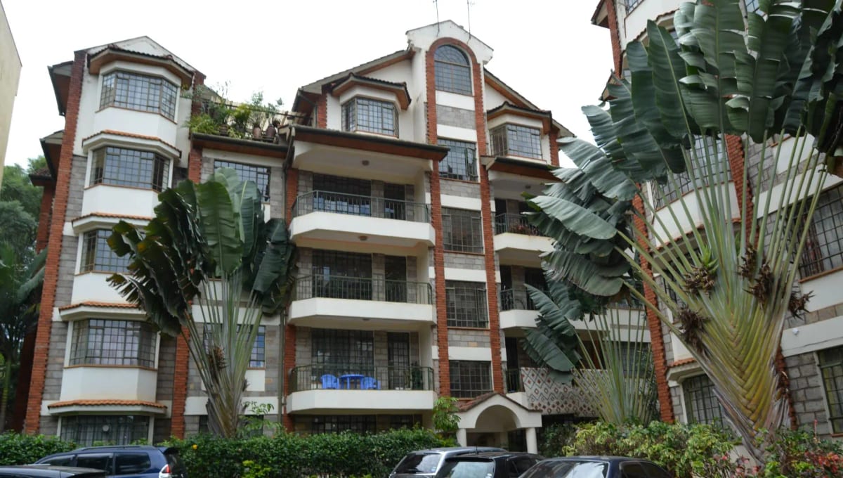 Multi-story residential building with brick facade and balconies