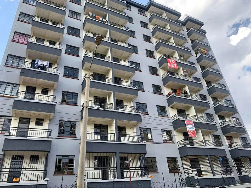 Multi-story residential apartment building facade with balconies