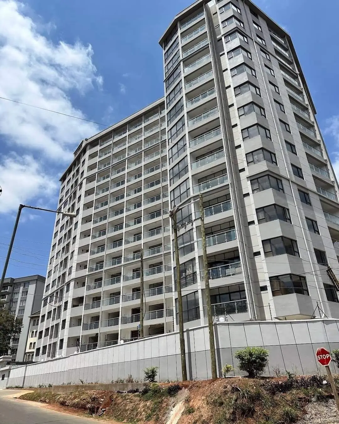 Modern multi-story residential building facade with balconies