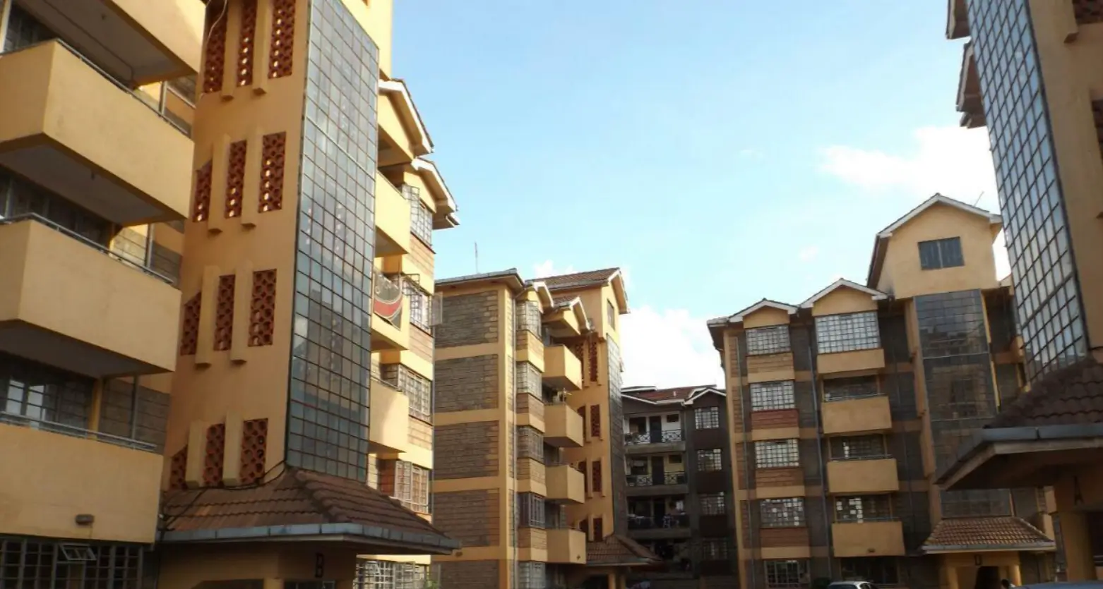 Multi-story residential apartment building complex with shared courtyard