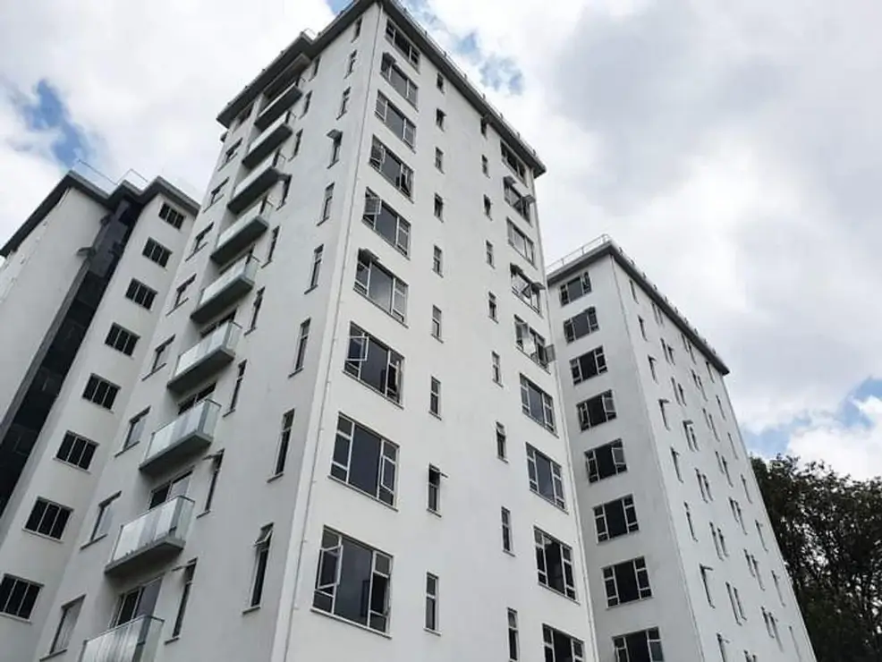 Modern multi-story residential building facade with balconies