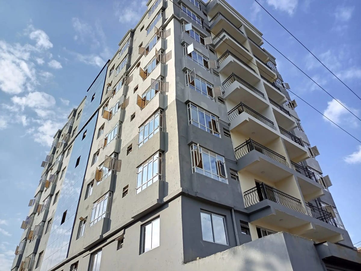 Multi-story residential building facade with balconies and windows
