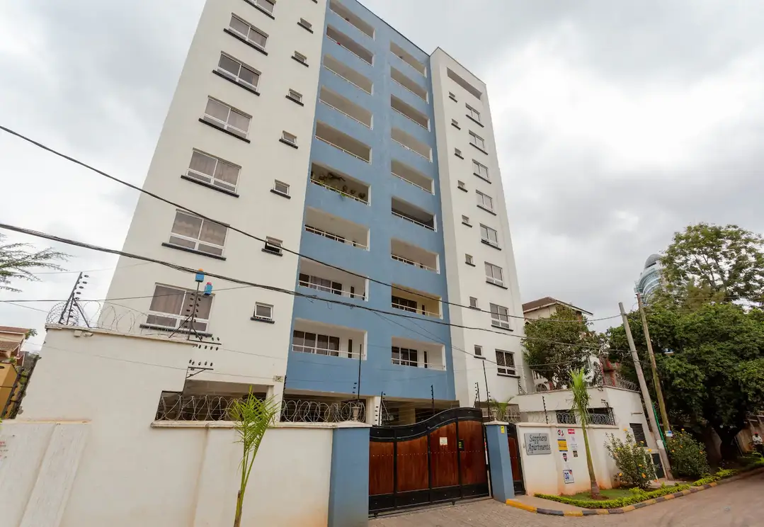 Multi-story residential building with blue and cream facade