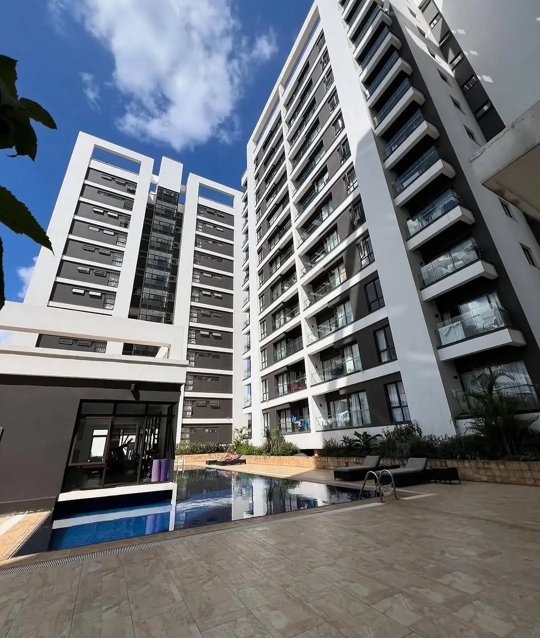Modern multi-story residential building with compound courtyard