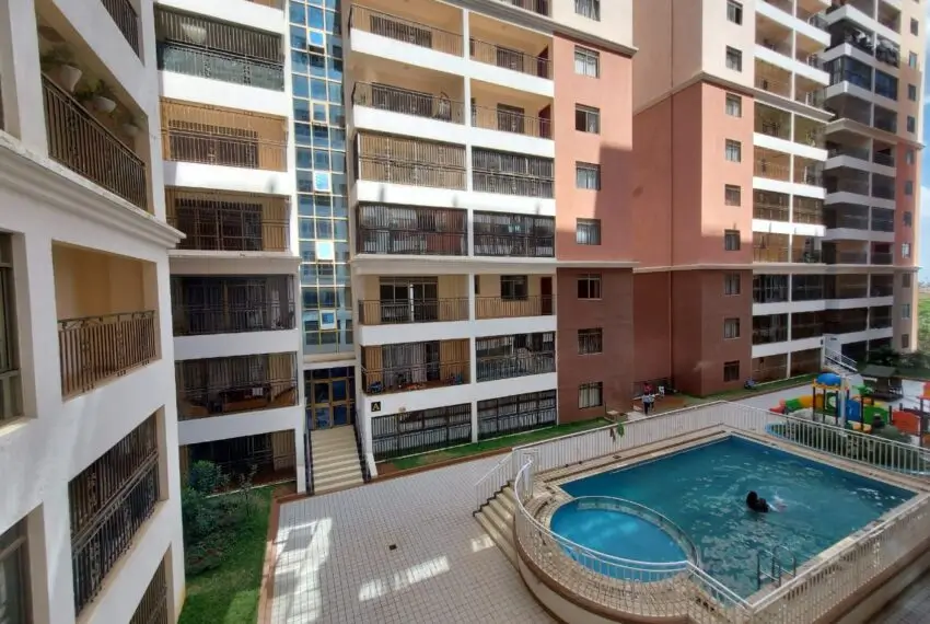 Residential compound pool with surrounding apartment buildings