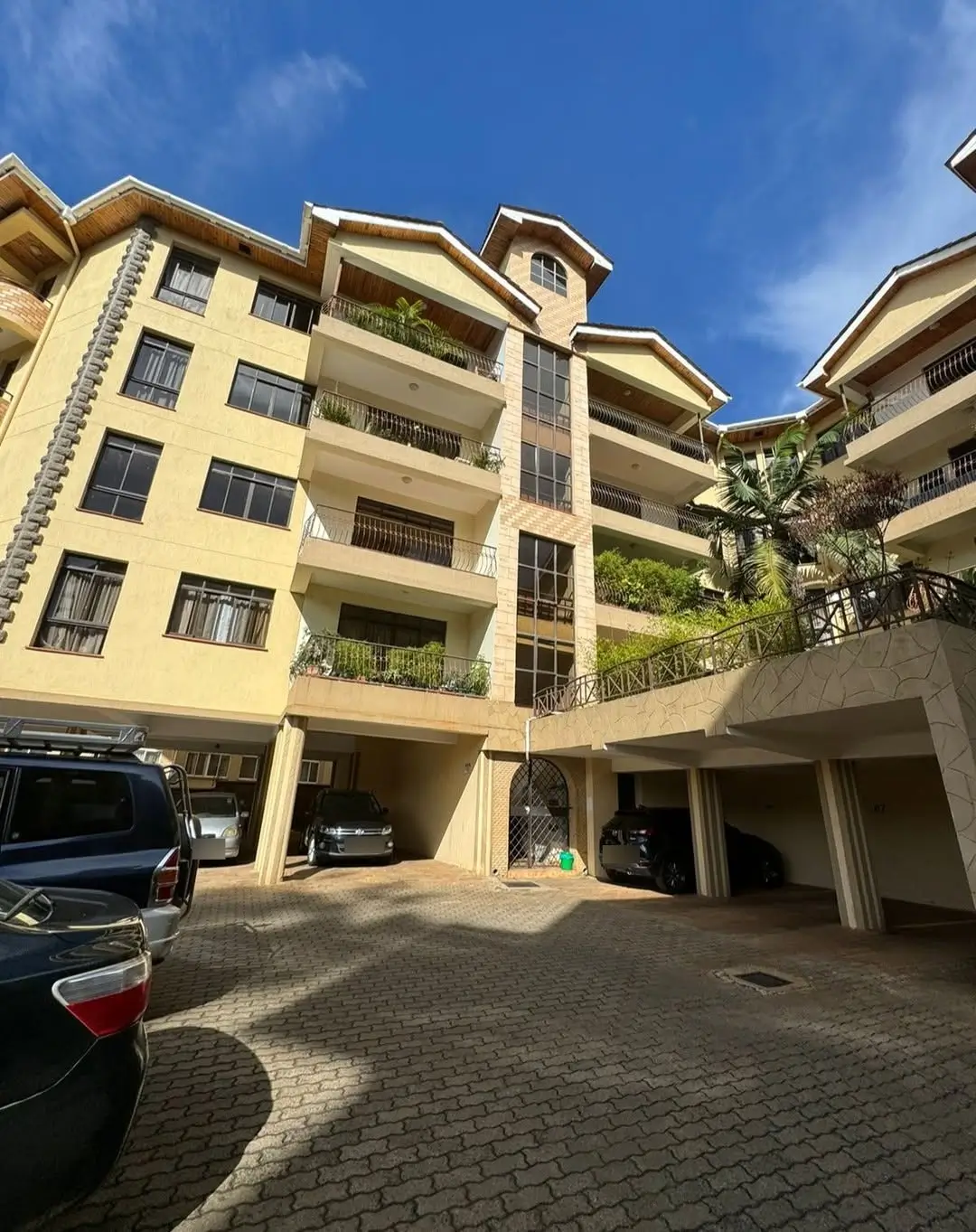 Multi-story residential building with basement parking and balconies
