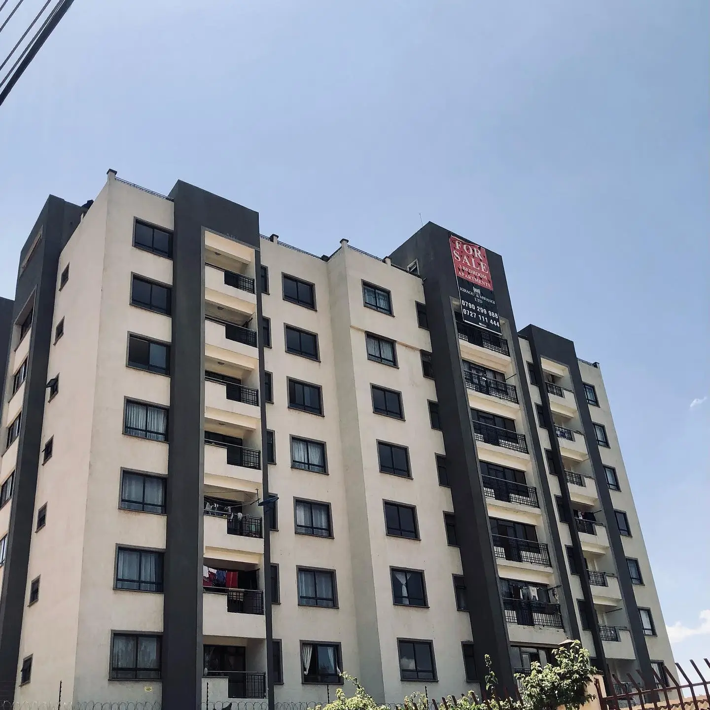 Modern multi-story residential building facade with balconies