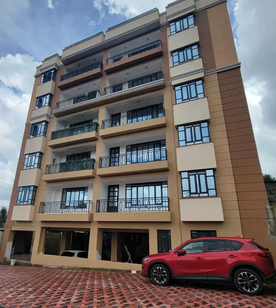 Modern residential apartment building with brick parking forecourt