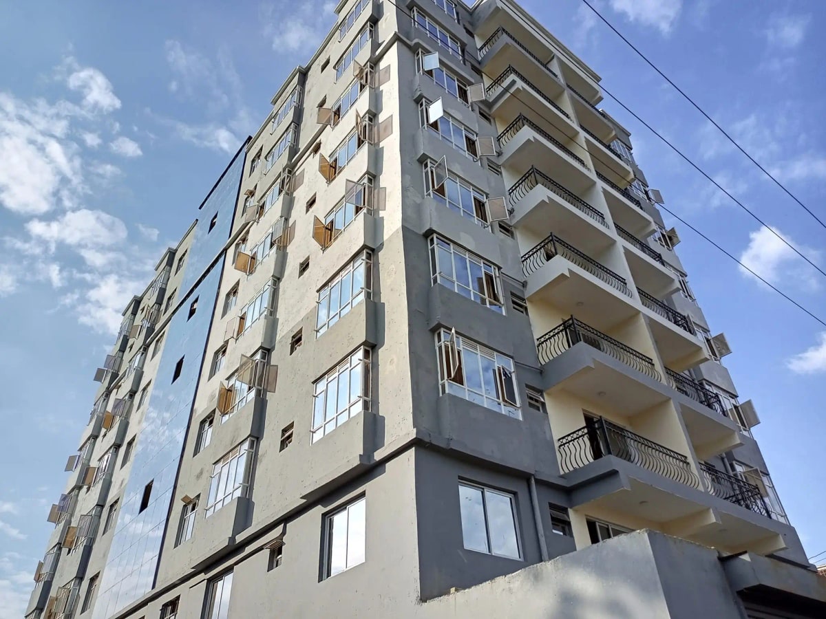 Multi-story residential building facade with balconies and windows