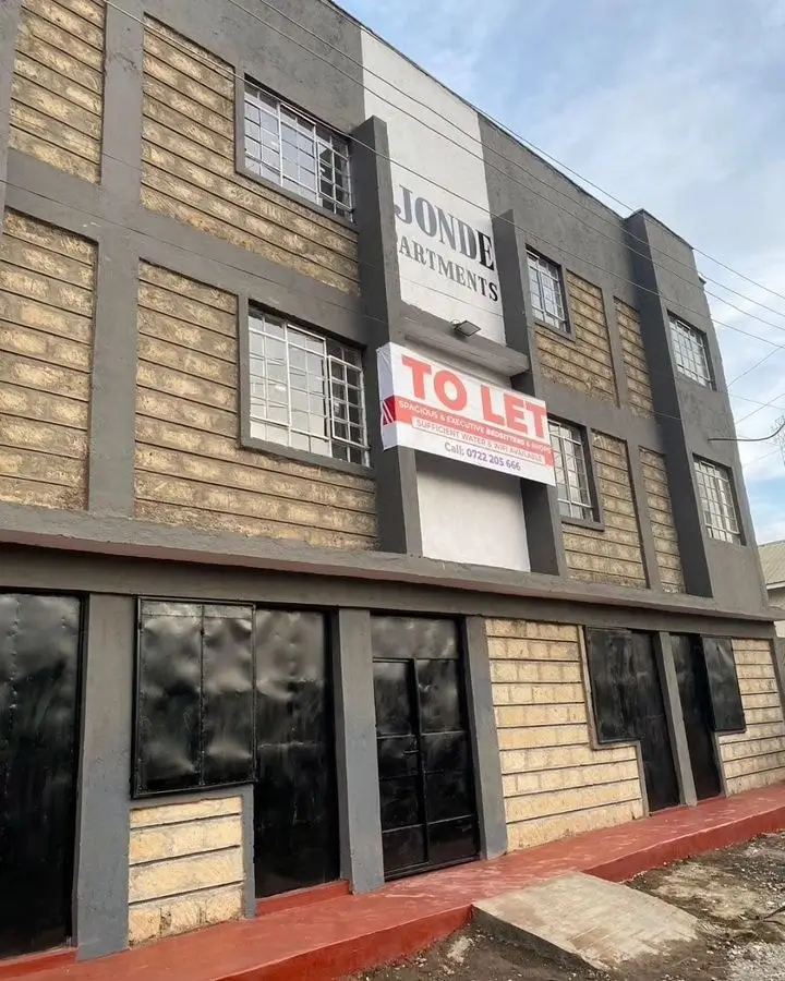 Multi-story residential building facade with TO LET signage