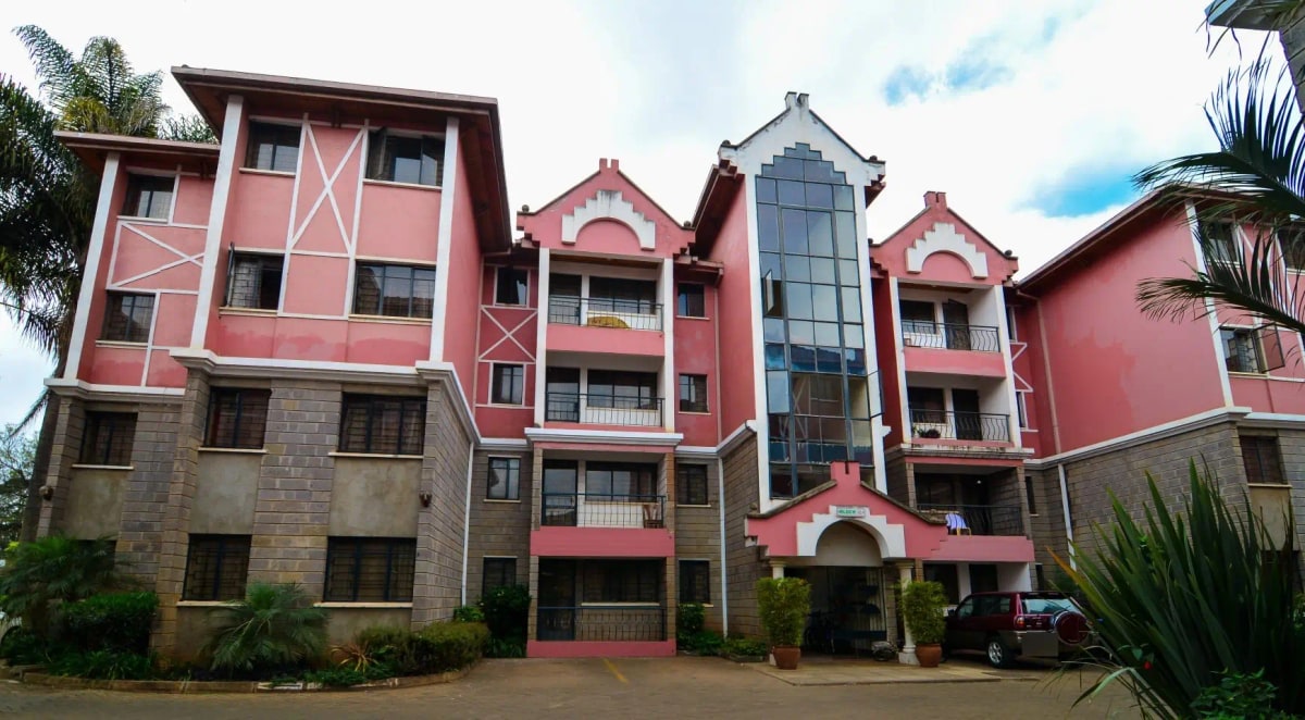 Red and stone residential building facade with multiple stories
