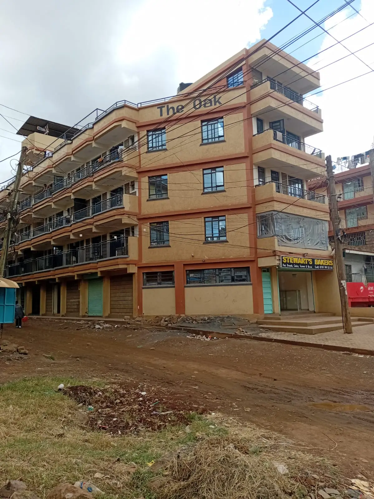 Multi-story orange residential building facade with balconies