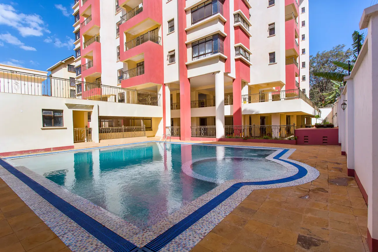 Residential compound swimming pool with blue mosaic tiles