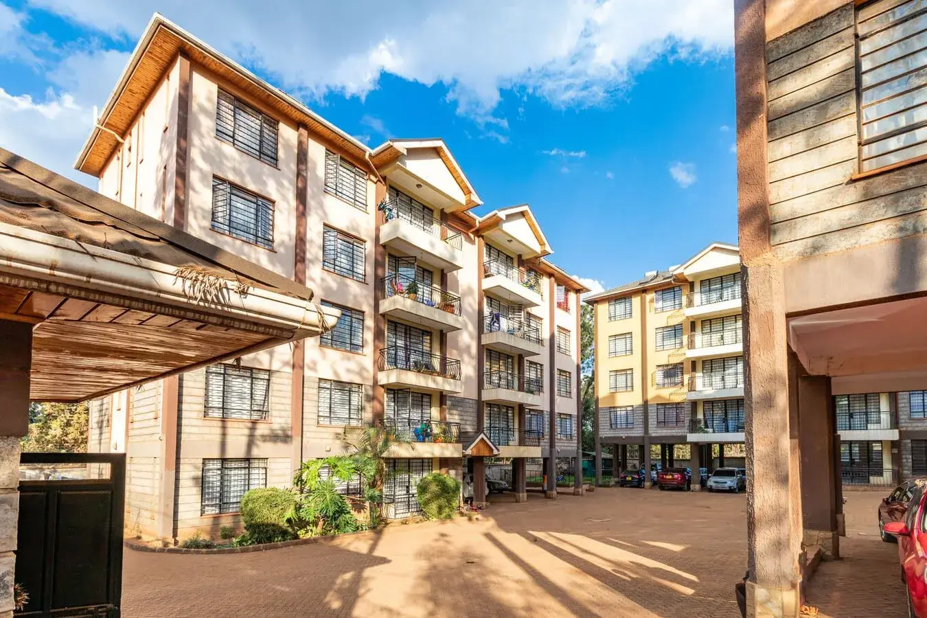 Multi-story residential apartment complex with courtyard entrance