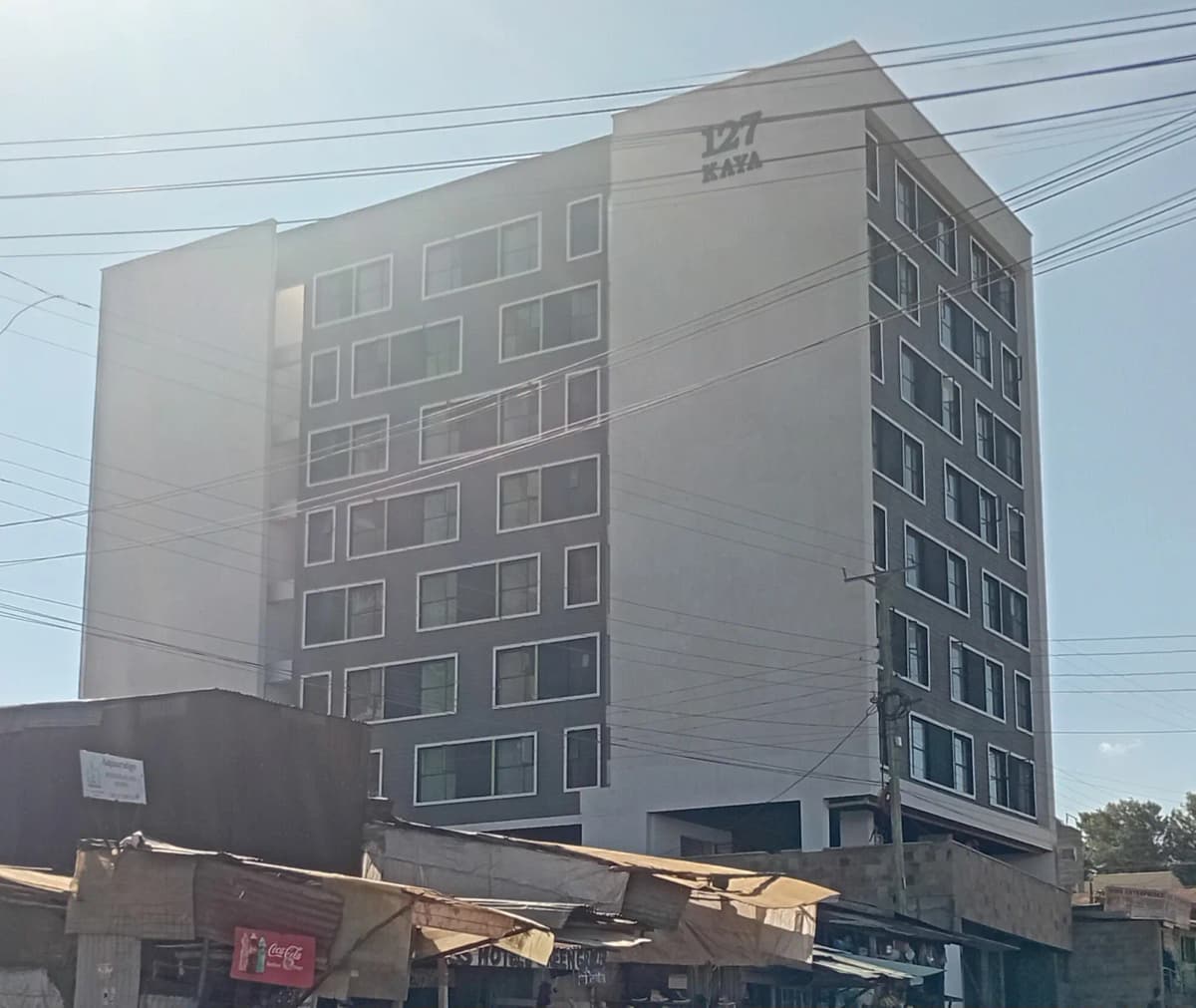 Modern mid-rise apartment building facade with regular window grid