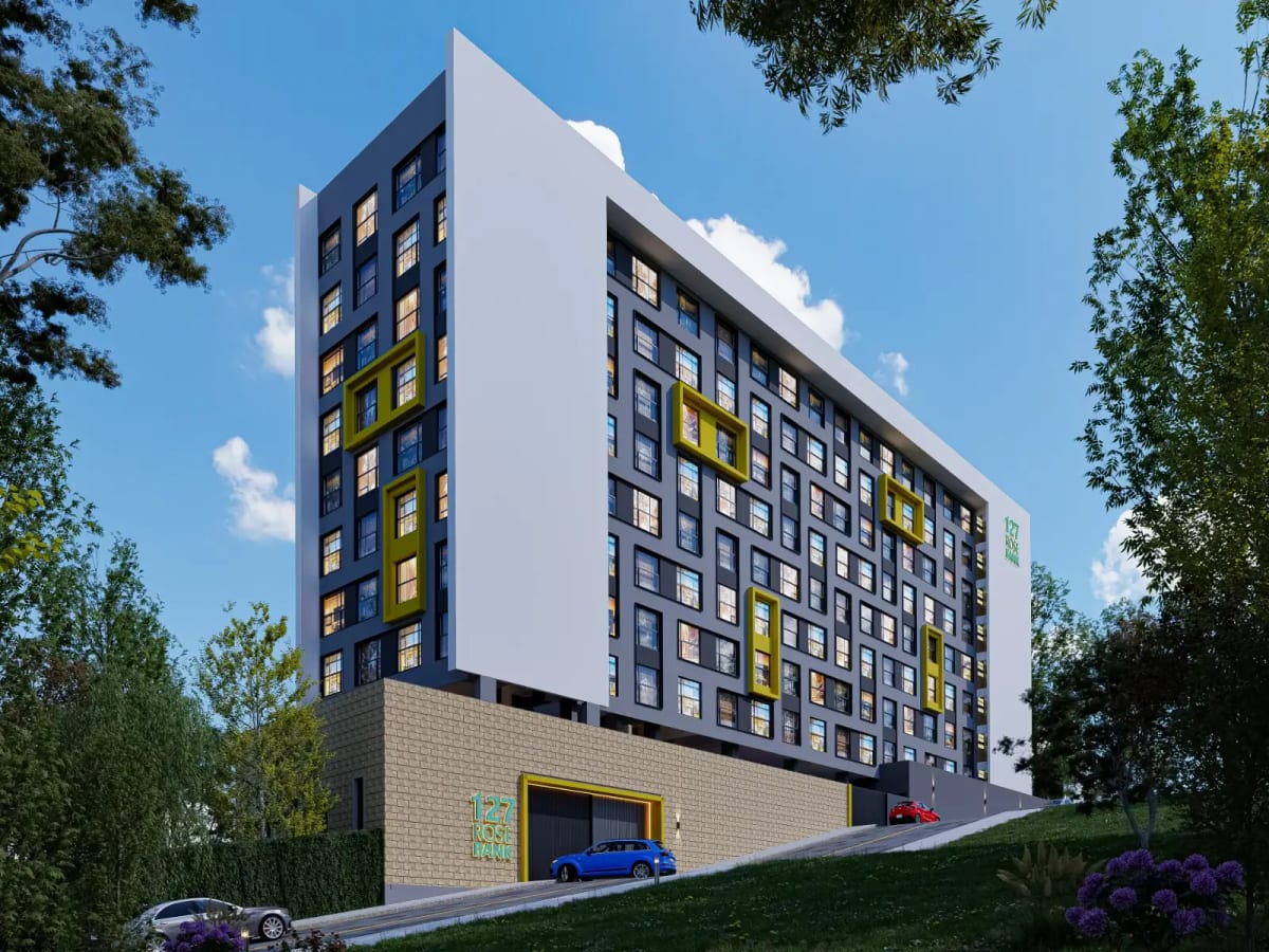Modern multi-storey apartment block with yellow accent windows