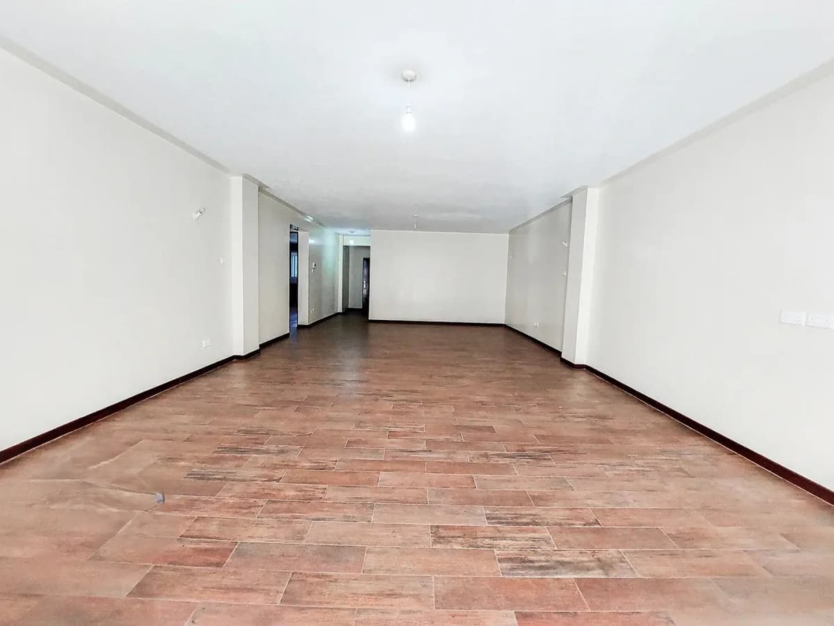 Spacious empty living room with terracotta tile flooring