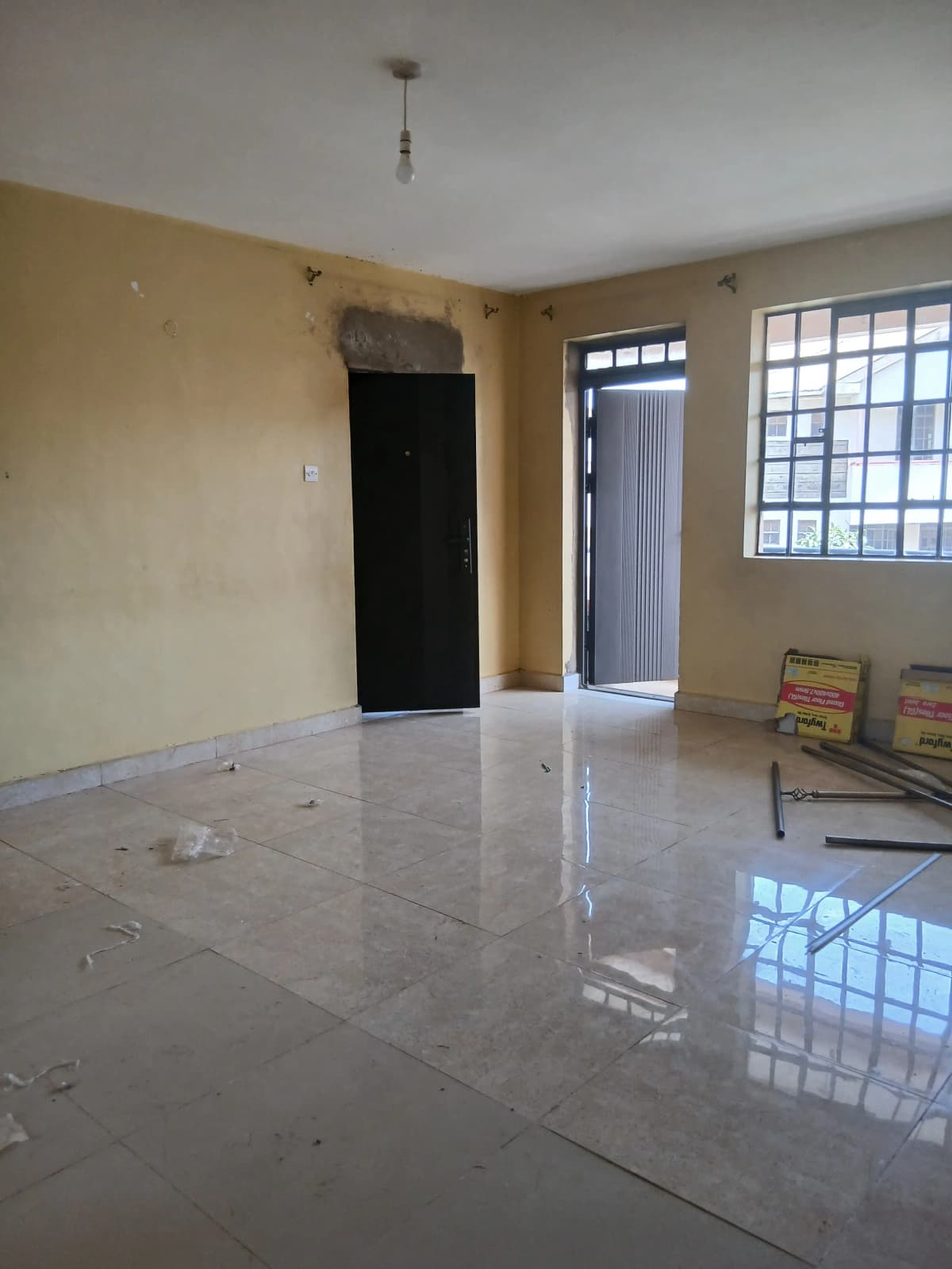 Spacious open living area with polished concrete flooring