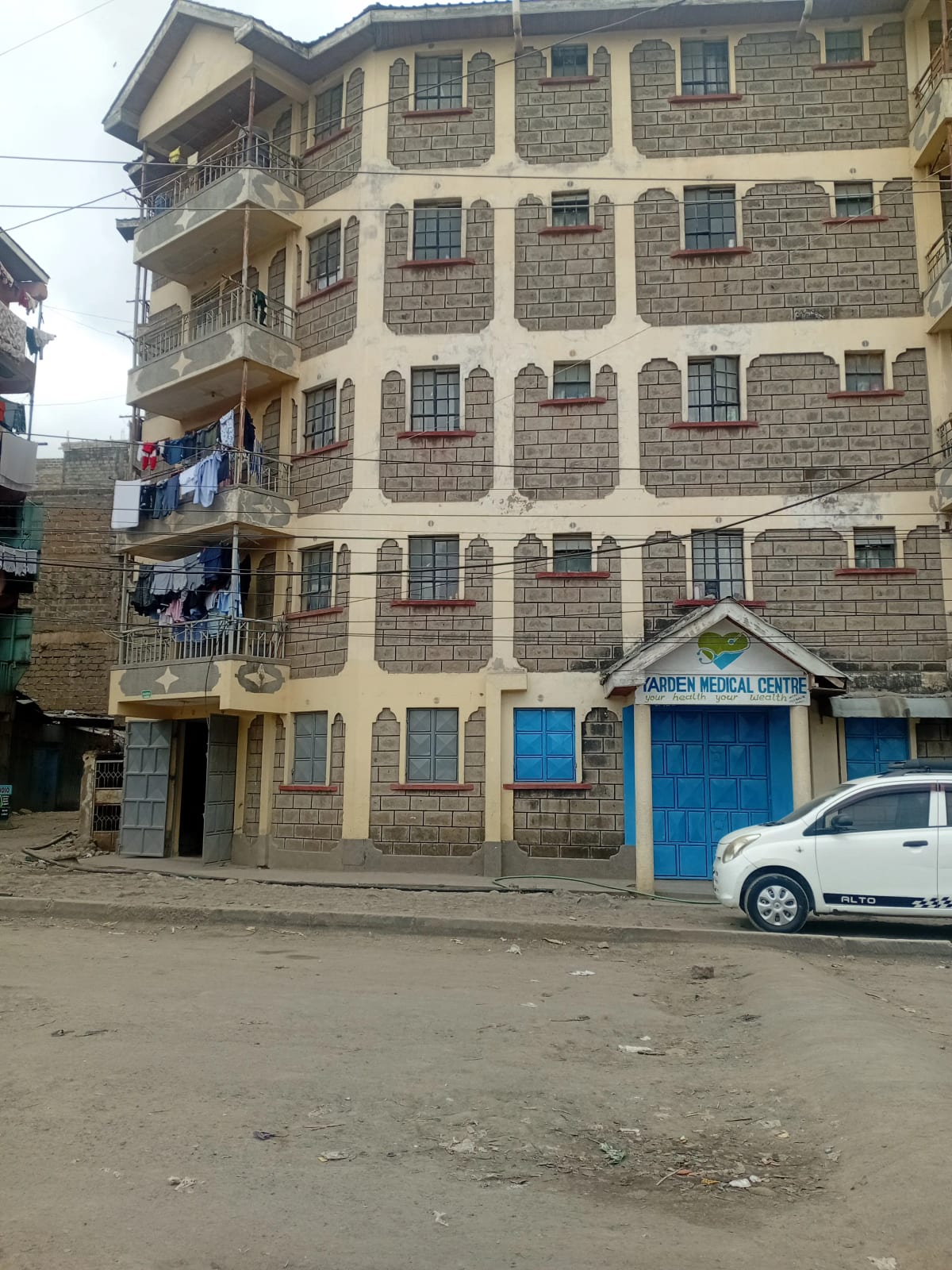 Multi-story residential building facade with stone finish