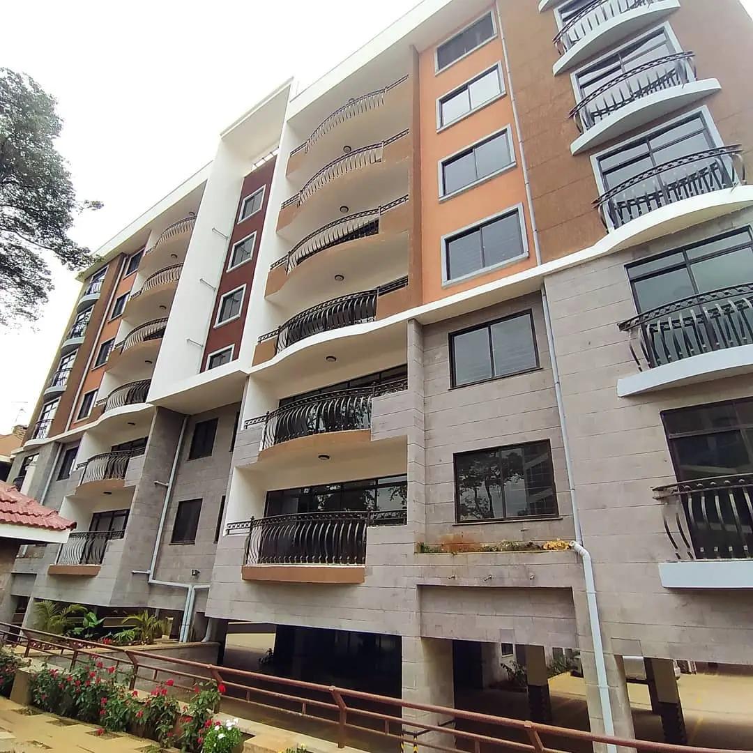 Multi-story residential building with balconies and mixed facade