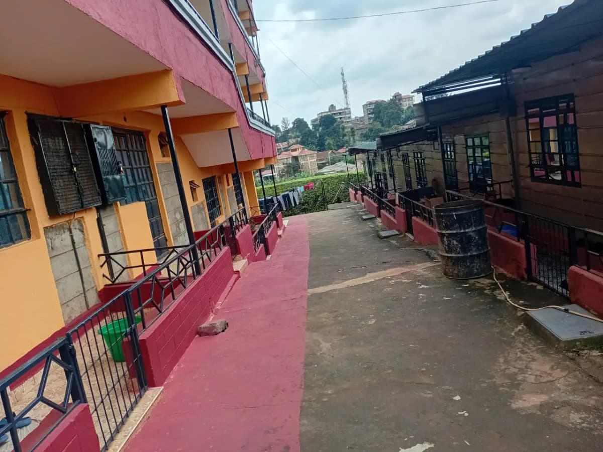 Compound pathway with colorful residential buildings and gates