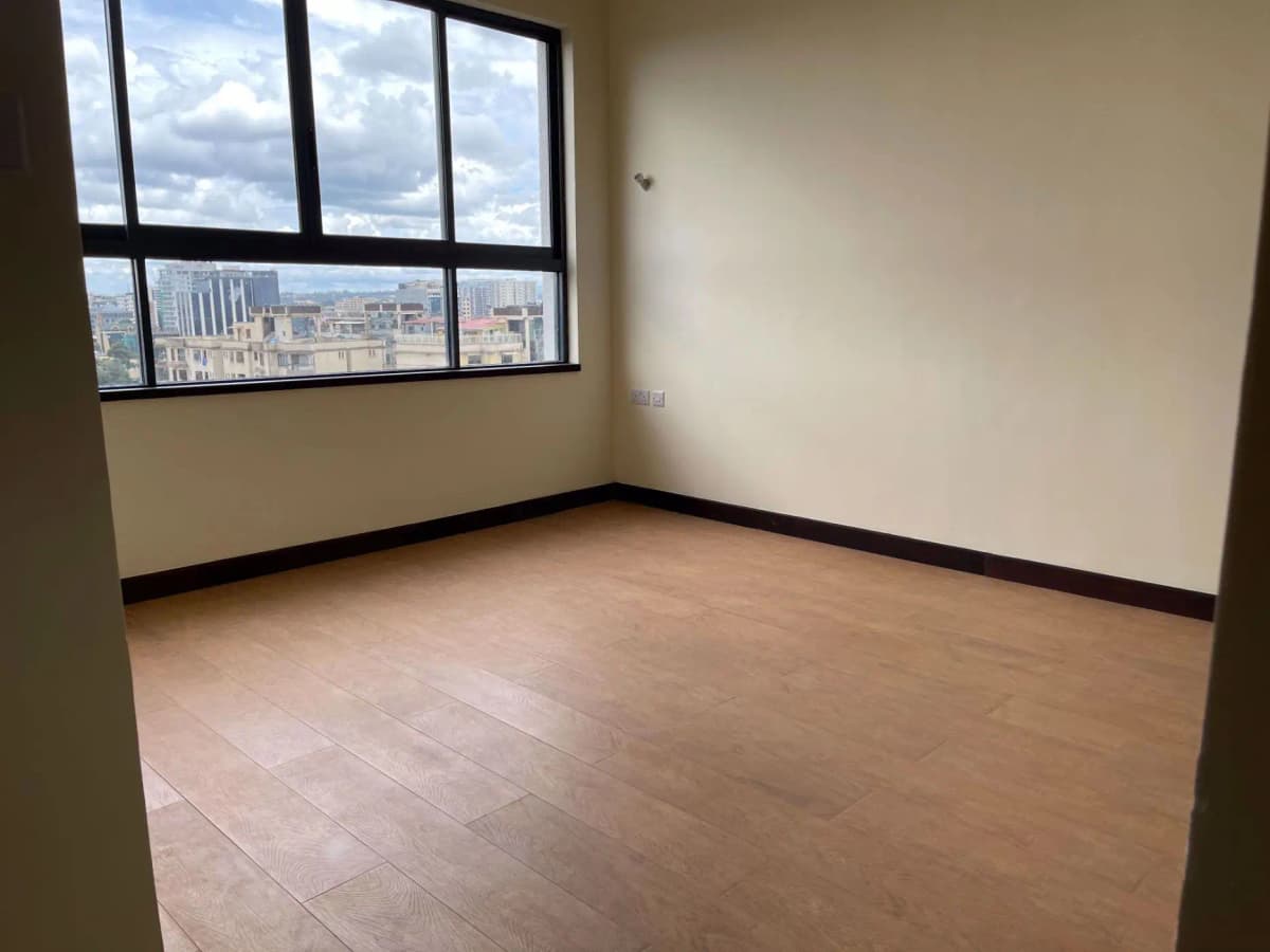 Spacious bedroom with panoramic city skyline views