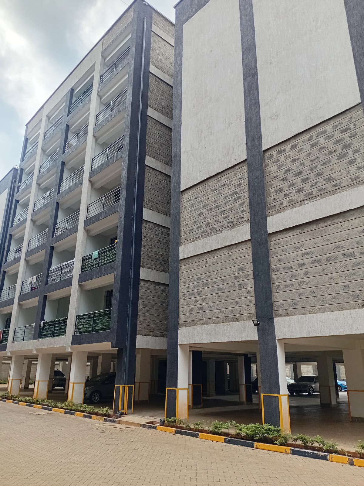 Modern apartment building facade with brick and concrete finish