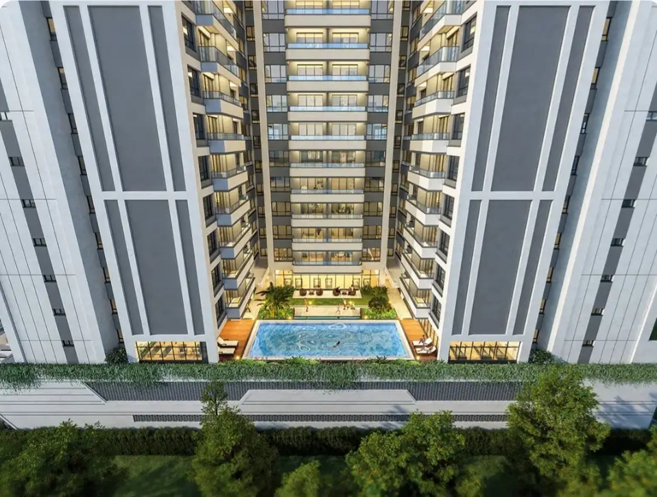 Aerial view of courtyard pool between twin towers