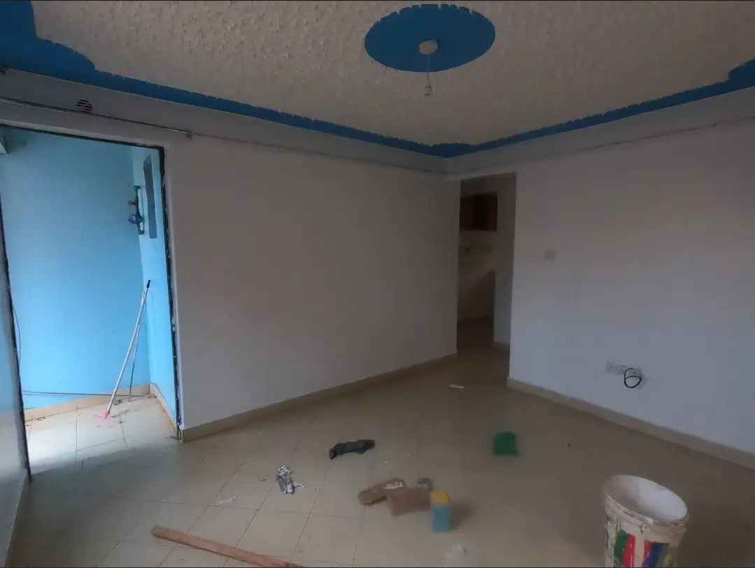 Empty living room under construction with blue ceiling trim