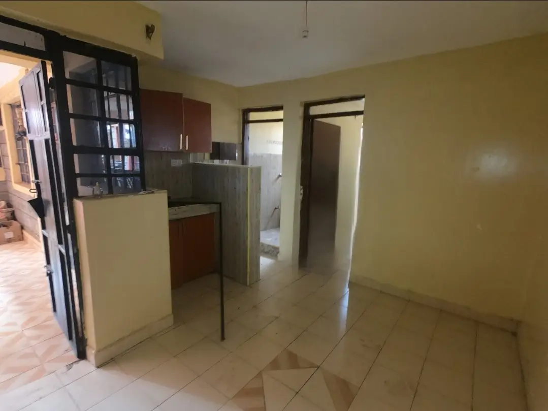 Open-plan kitchen and living area with yellow walls