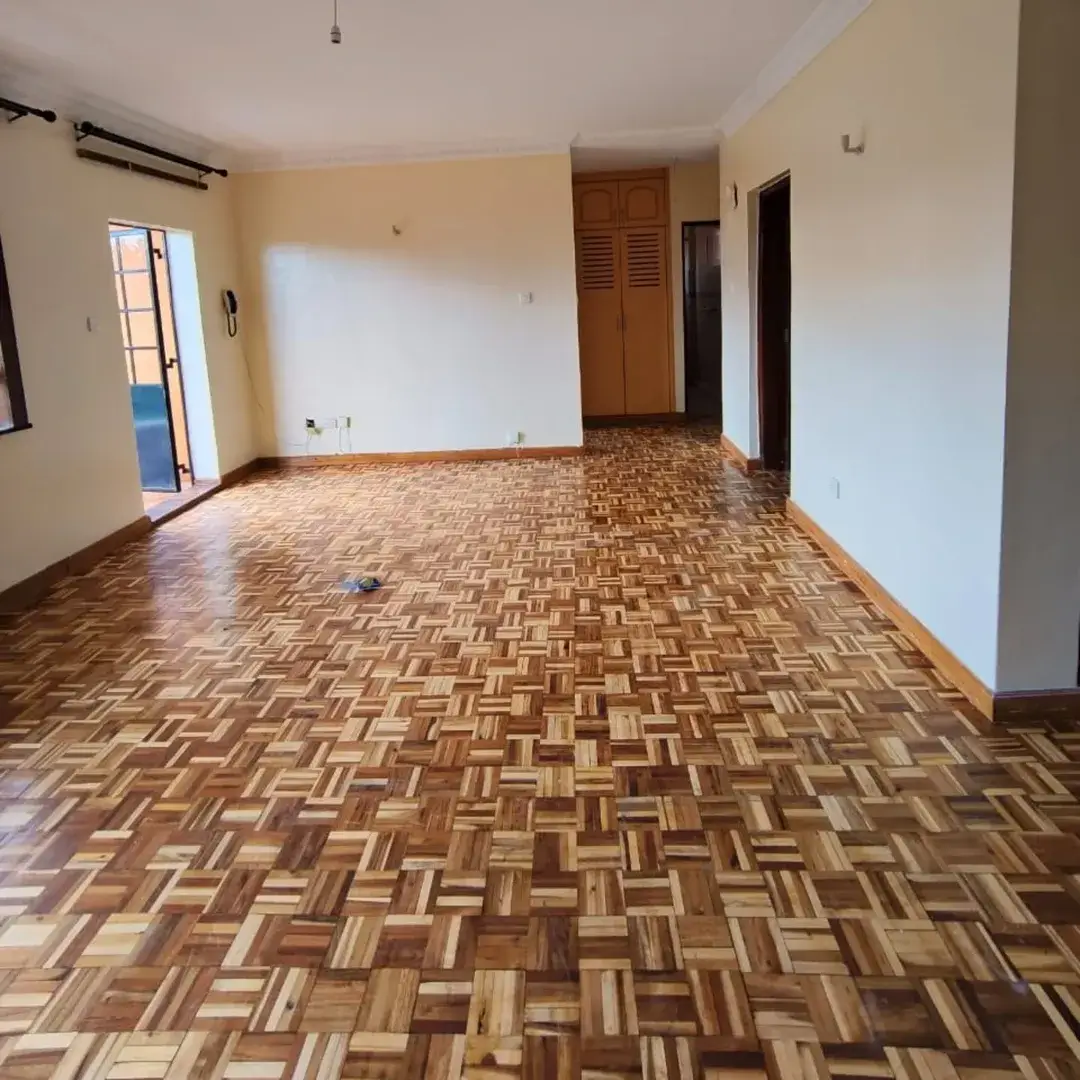 Spacious living room with herringbone wooden flooring