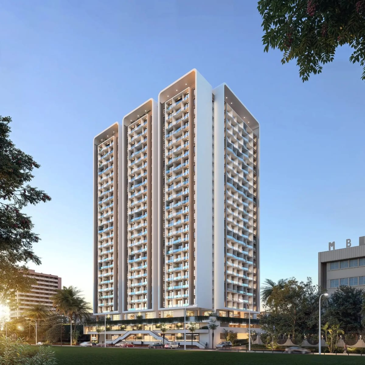 Tall modern high-rise tower with balconies at dusk