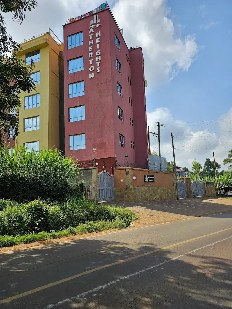Multi-story residential building with red and yellow facade