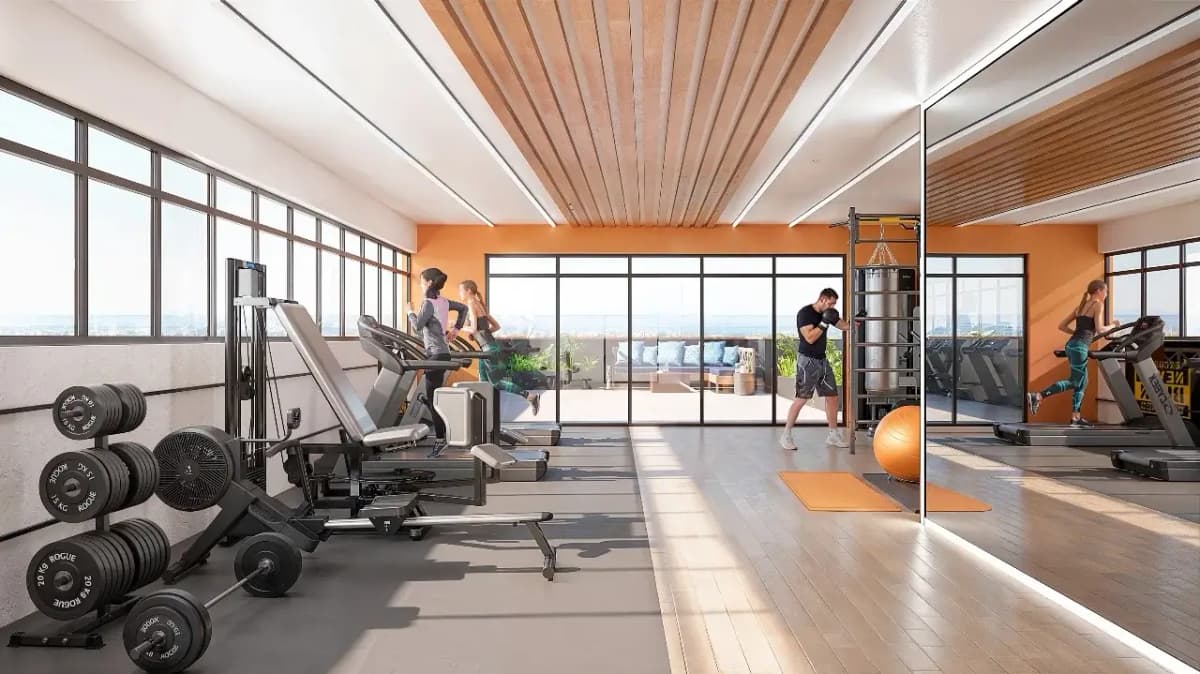 Modern gym with treadmills, weights, and floor-to-ceiling windows