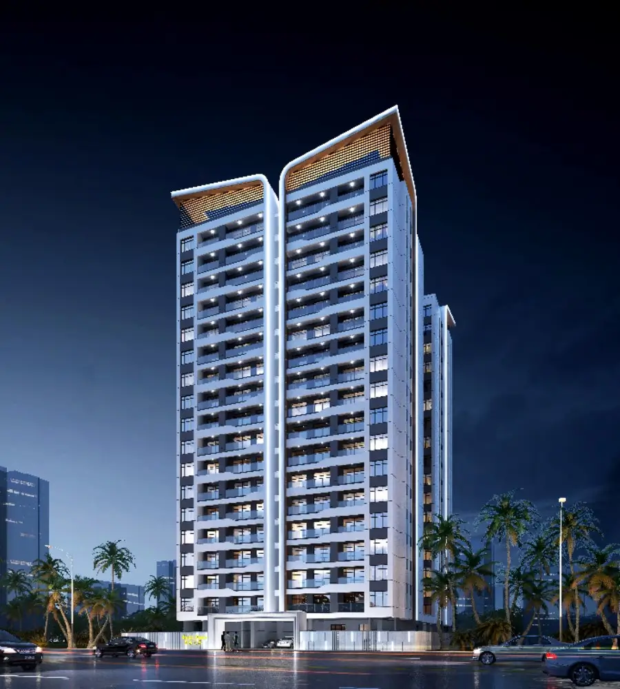 Tall modern apartment tower illuminated at night