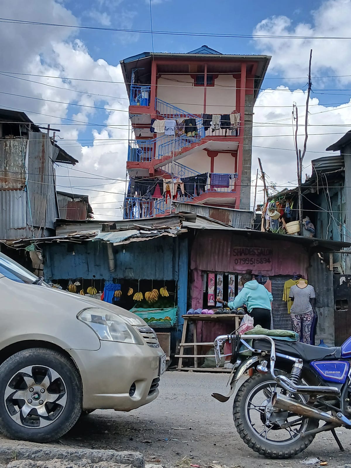 Multi-story residential building facade with street-level shops