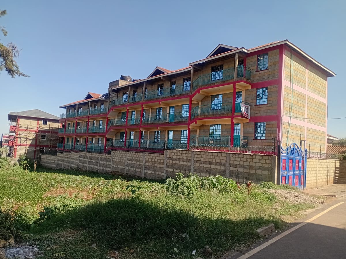 Multi-story residential building with colorful painted facade