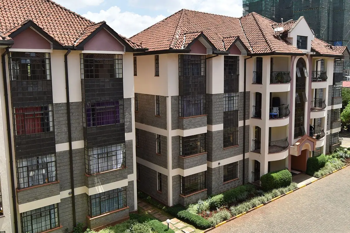 Multi-story residential building with terracotta tile roof