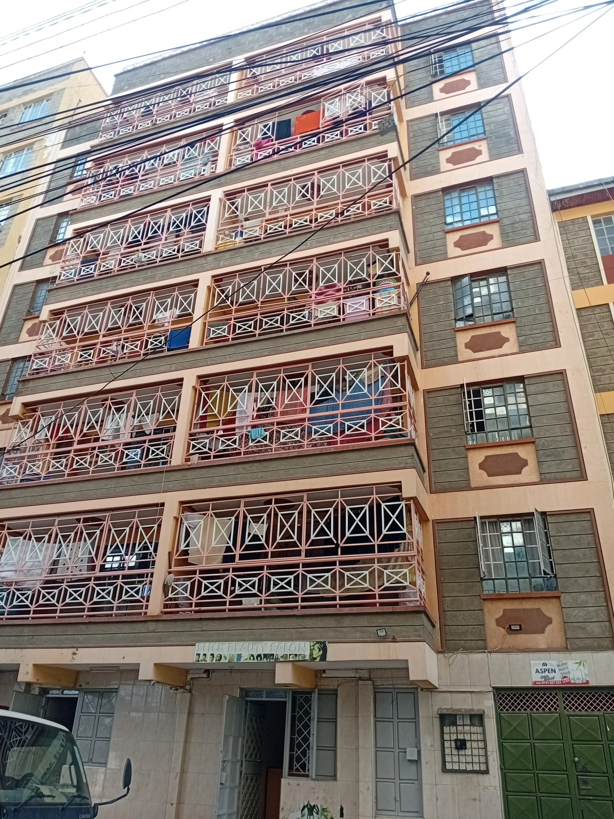 Multi-story residential building facade with balconies and windows