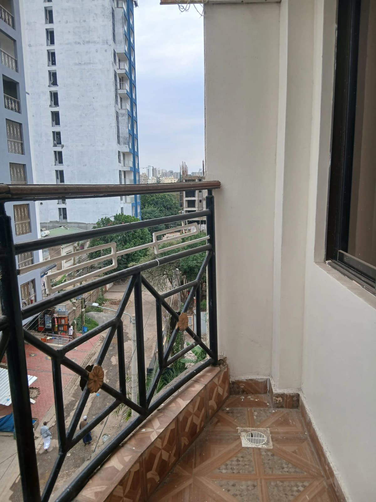 Balcony with city skyline and neighboring buildings view